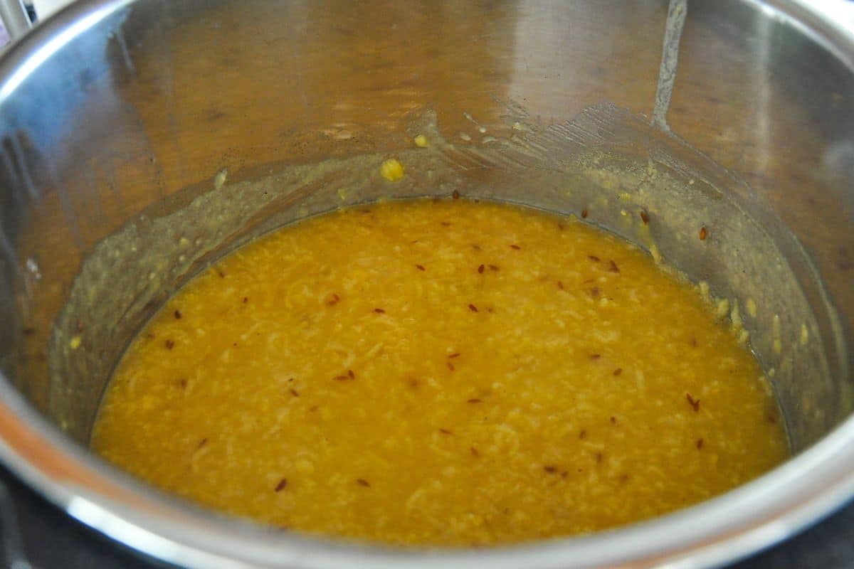 Add water to khichdi for a runnier consistency.