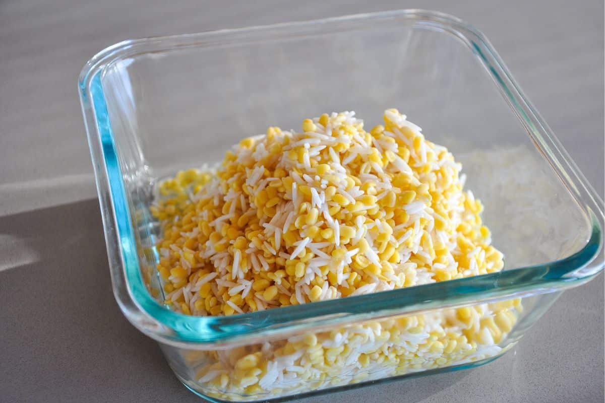 Drain washed rice and lentils in a bowl.