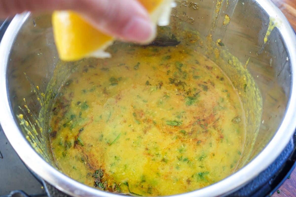 Squeeze lemon juice over Masoor Dal.