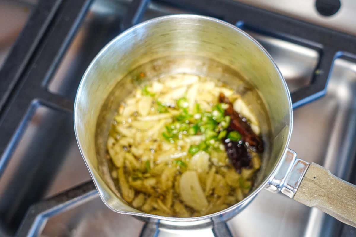 Tadka for Masoor Dal with green chilies and garlic added.