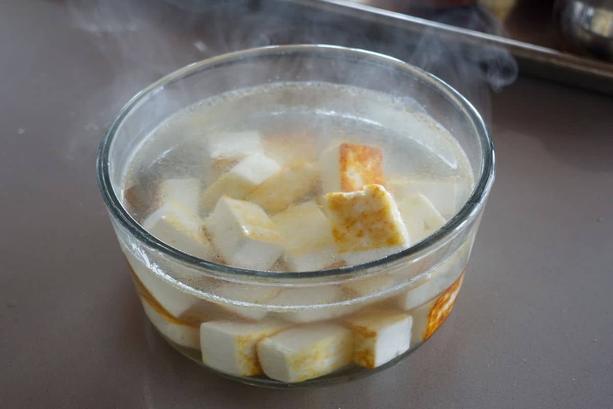 Pour boiling water over the paneer and let it sit for 20-30 minutes.