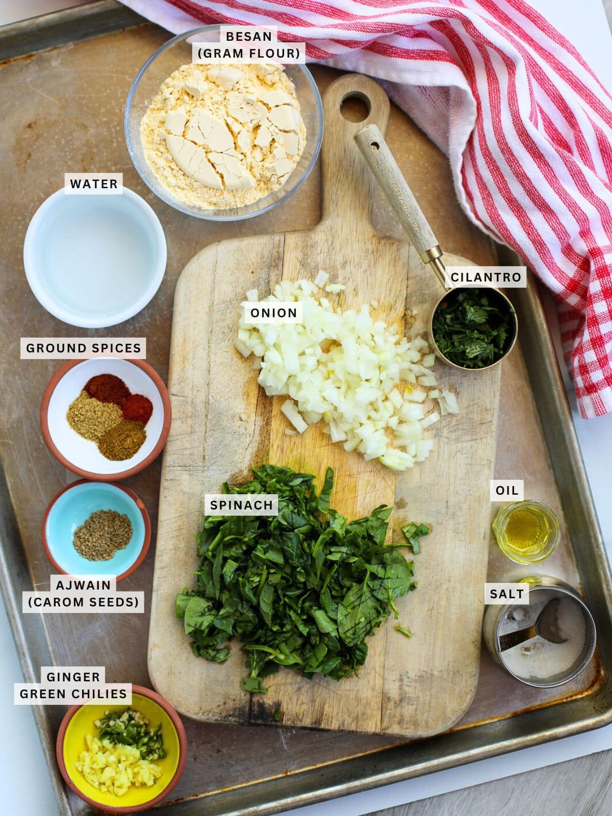 Ingredients for Spinach Besan Chilla on a tray.